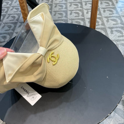 BOW BUCKET HAT IN EGG NOG BEIGE RAFFIA 426170