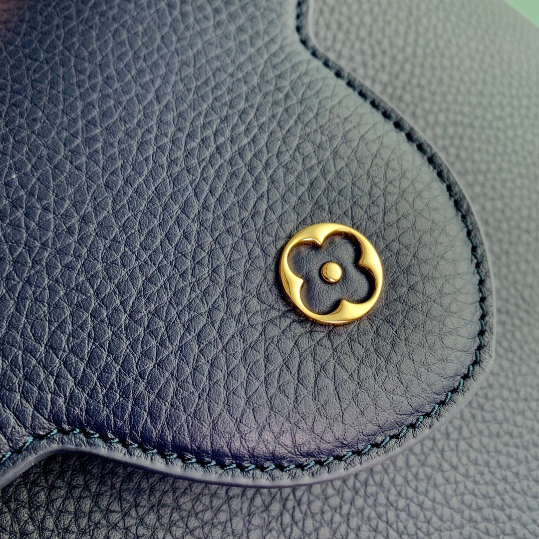 capucines mm 31.5 dark blue taurillon leather gold hardware